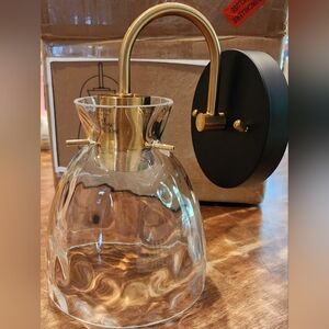 Two bathroom vanity light sconces.